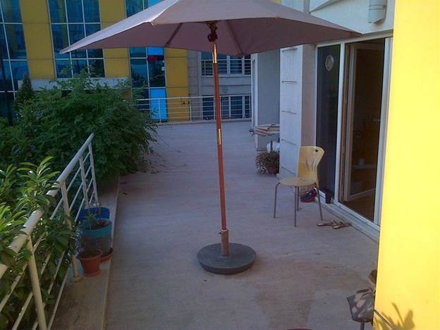 9. DIY Concrete Umbrella Stand