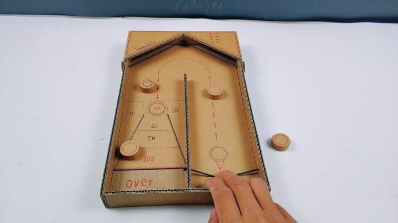 13. DIY Desktop Shuffleboard Table With Cardboard