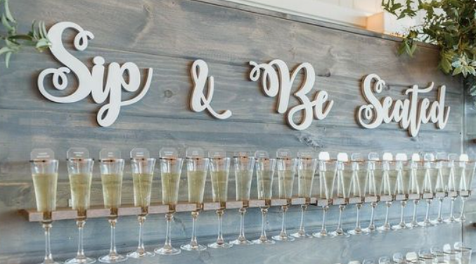 7. Champagne Wall Idea For Guests