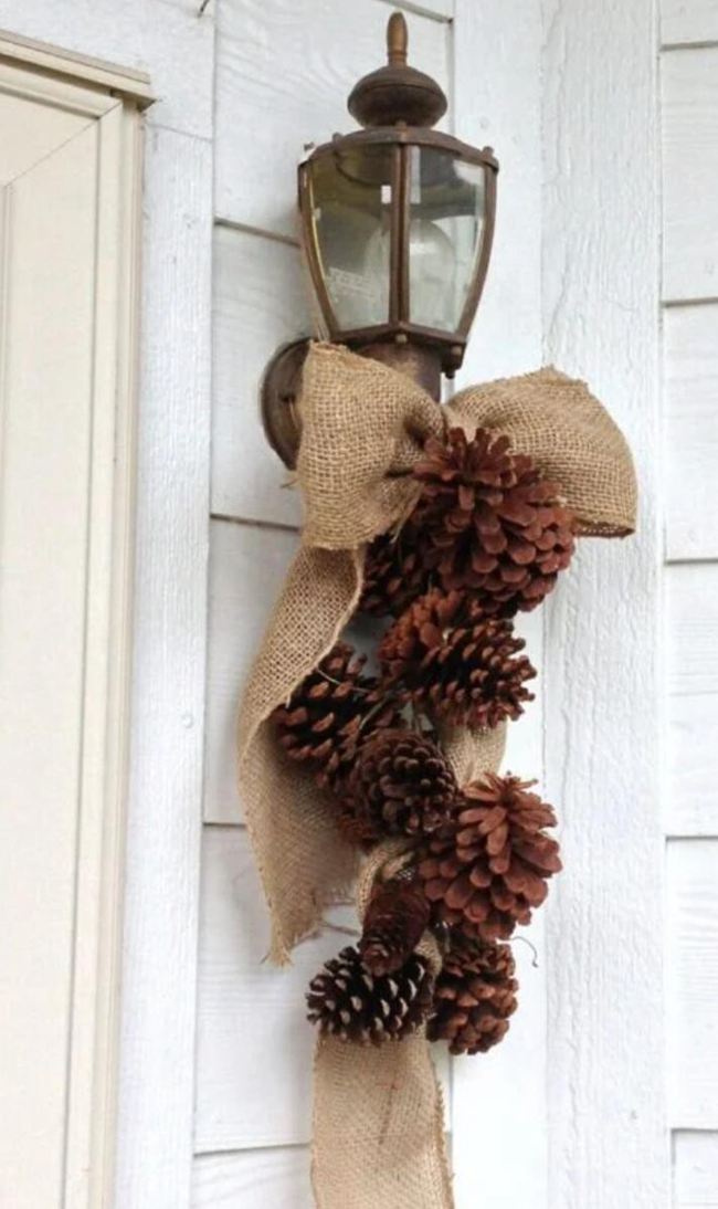 37. Porch Light With Hanging Pinecones