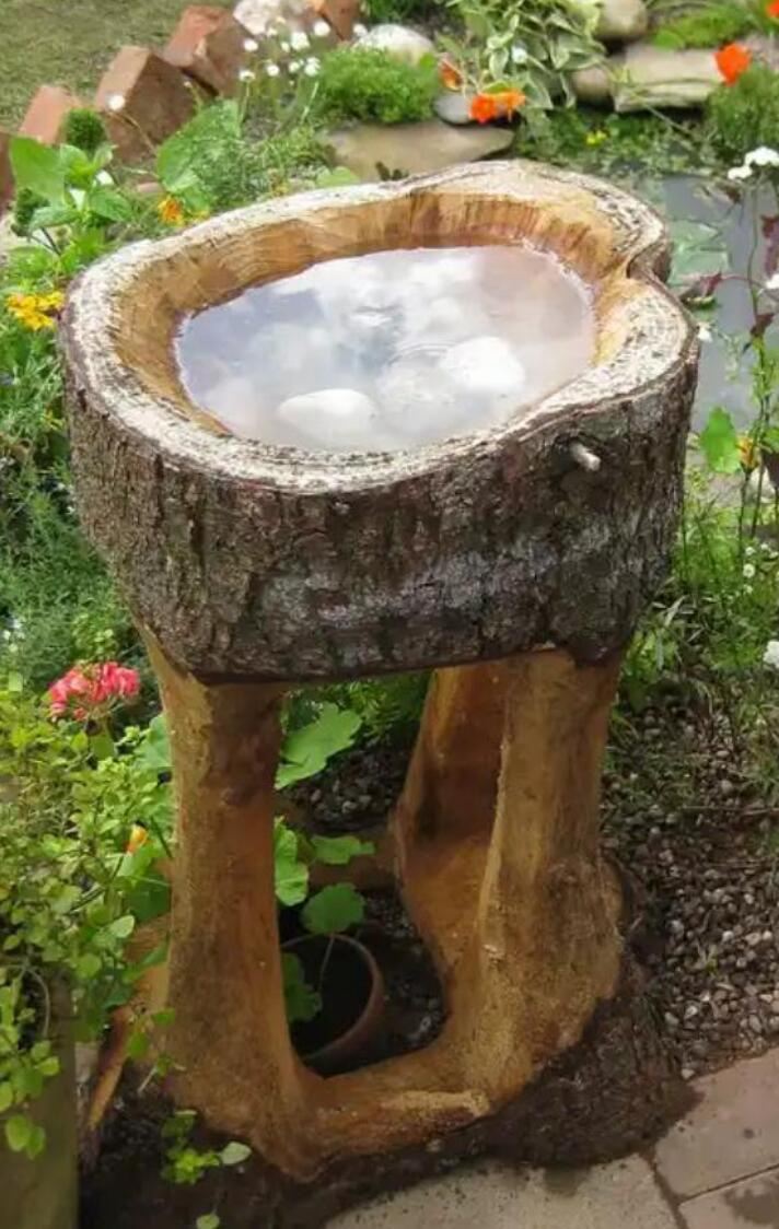 18. The Solid Wood Bird Bath