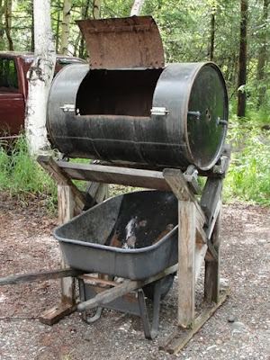 8. Repurposed Wheelbarrow and Barrel Type Compost Bin